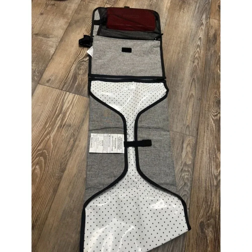 Travel diaper clutch and changing pad